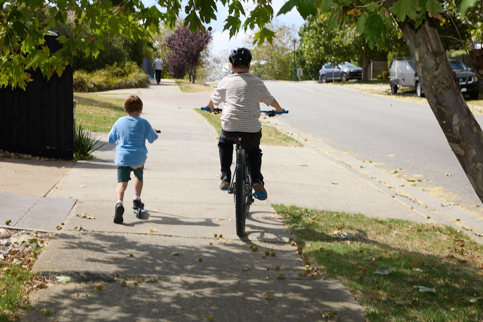 Kids exploring outdoors on bikes with Waffle screen-free kids phone