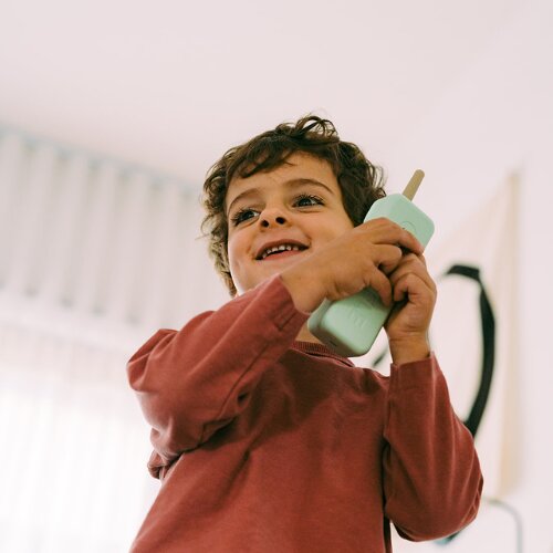 Boy chatting on a Waffle screen-free phone for kids