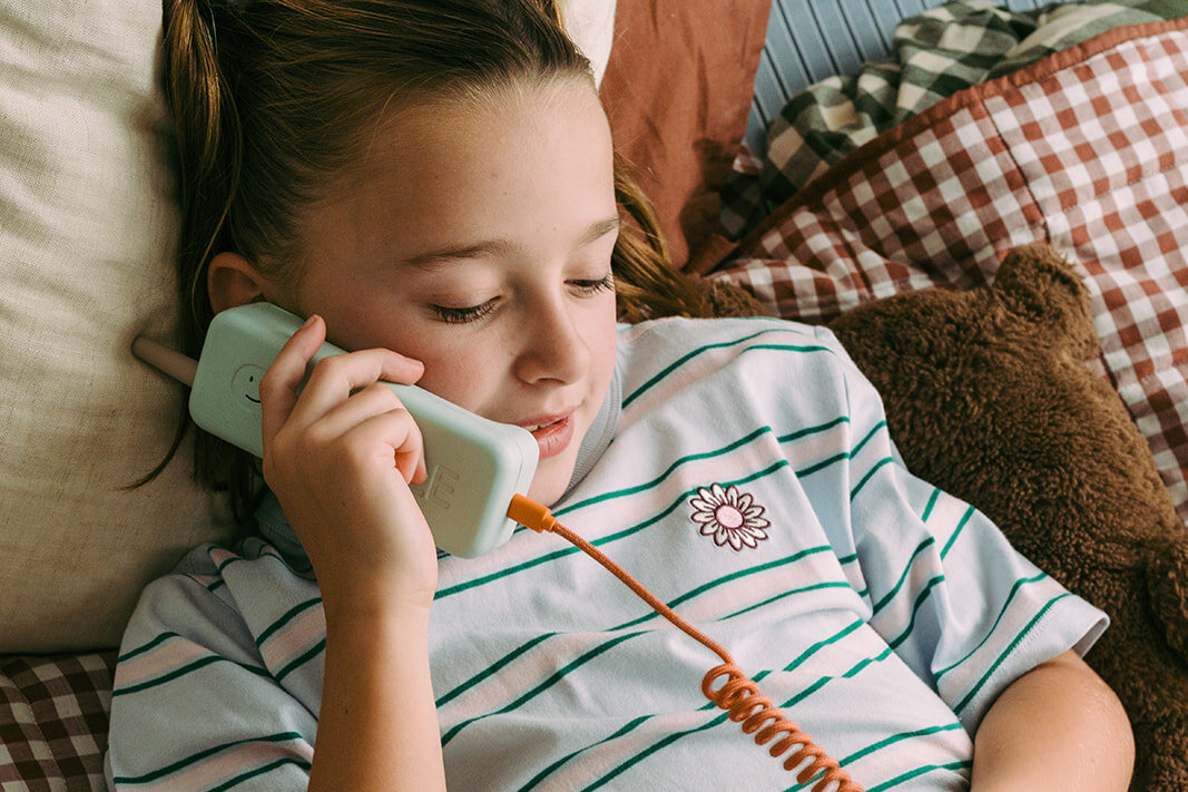 Child using Waffle screen-free kids phone at home